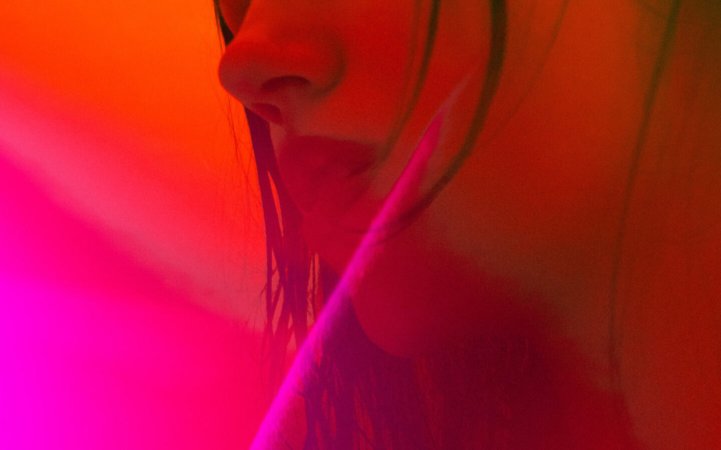 Abstract woman in red neon lighting