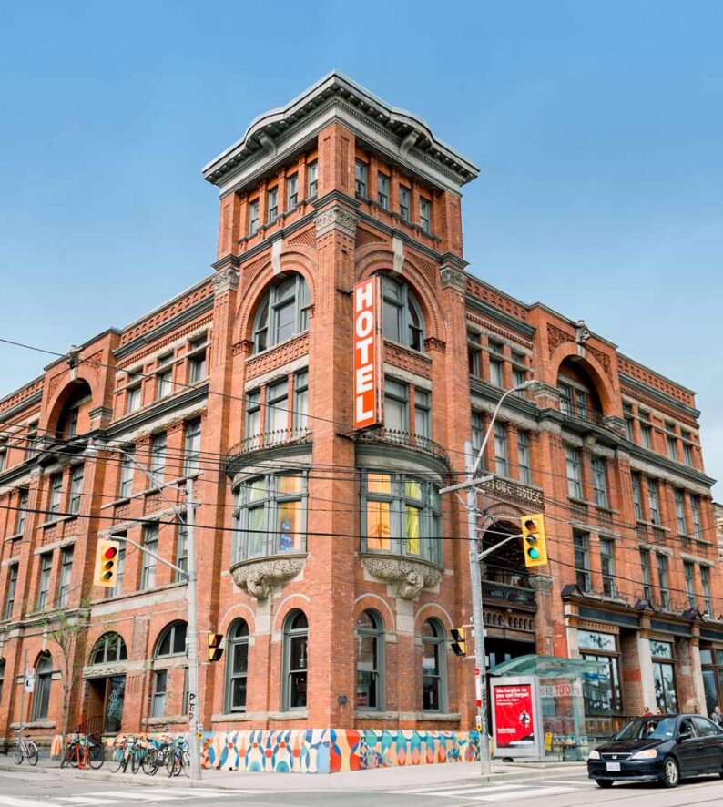 hotel building at a main intersection during daytime