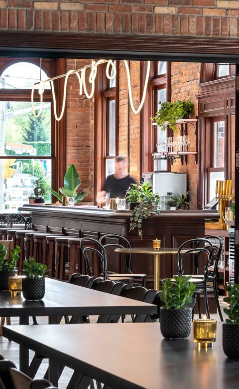 indoor brick wall cafe with tables and chairs