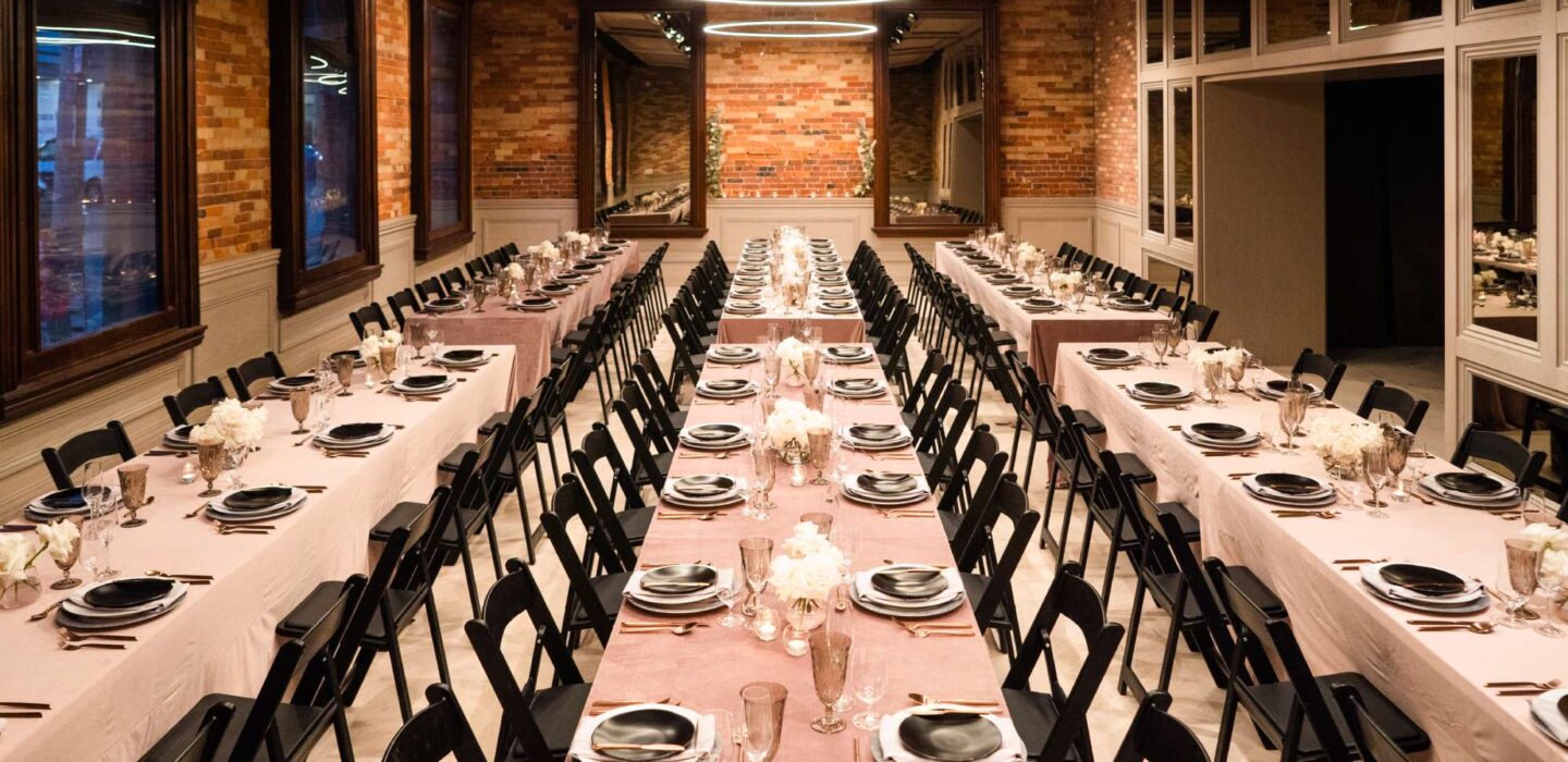 six large tables set for an event