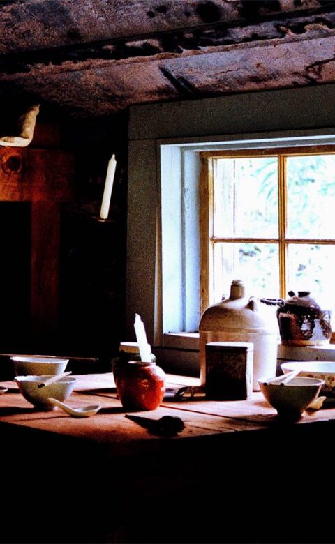 a table set up for a meal with bowls and chopsticks