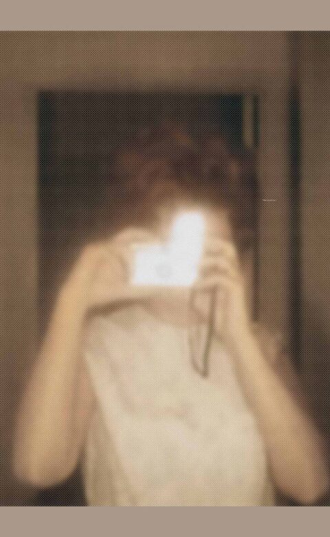 a mirror image of a person taking a photo